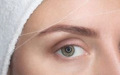 Precise eyebrow threading for clean brow shaping