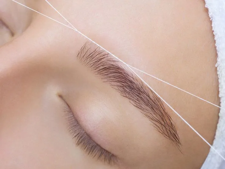 Gentle eyebrow threading process using twisted cotton thread