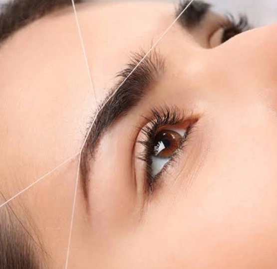Bridal eyebrow threading session for wedding beauty prep in Lower Manhattan