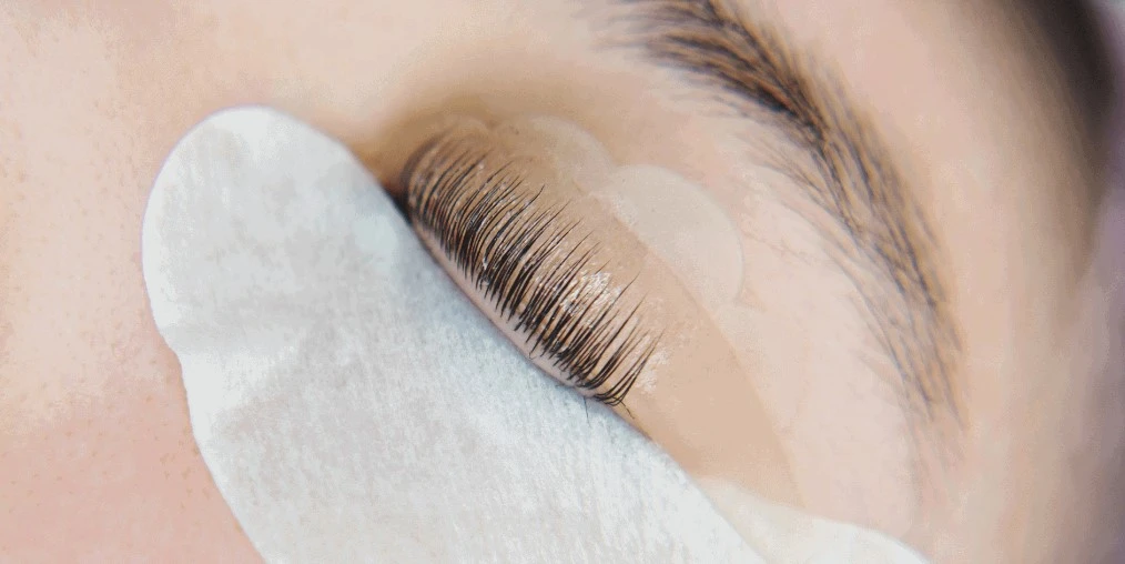 Applying eyelash lift silicone rod during bridal lash tinting patch test
